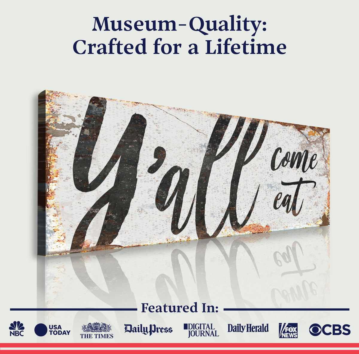 Framed canvas wall sign reading “Y’all come eat” in black calligraphy on white and tan