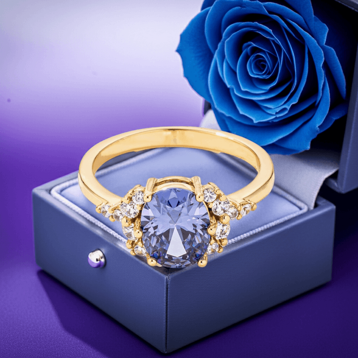 Gold-plated engagement ring with oval blue center stone and diamond-like side accents
